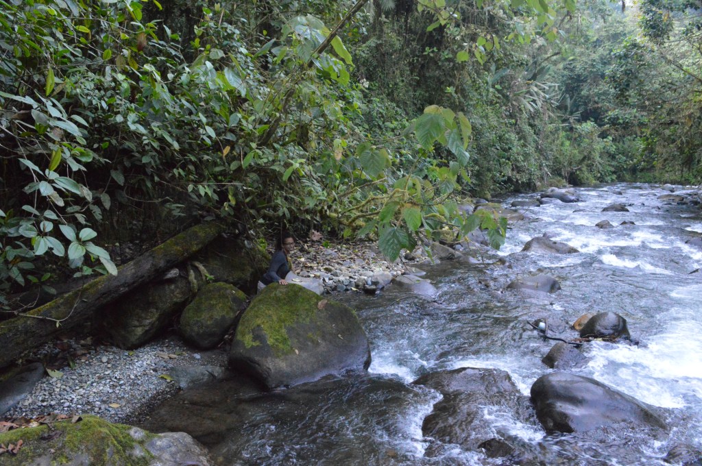 Erin climbing through boulders next to the river, one of our last days at Las Tangaras. 